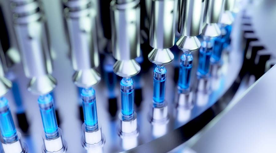 medicine production line, vials of blue liquid