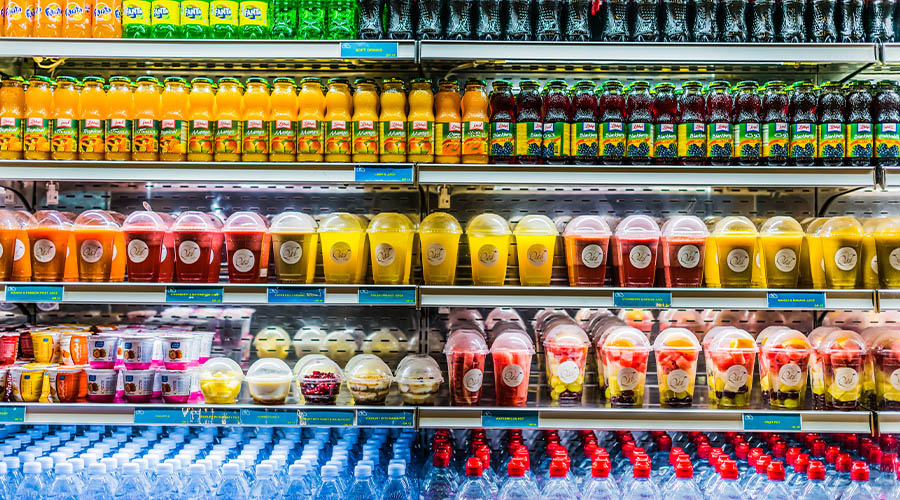 Shop display cabinet full of plastic bottles and other plastic packaging