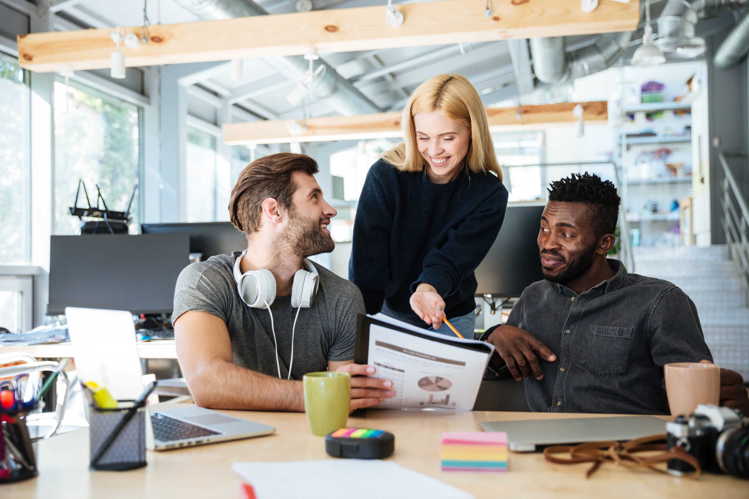 Office with young professionals at desk