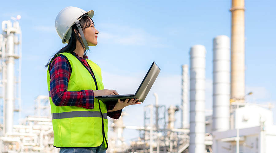 female engineer looking at factory