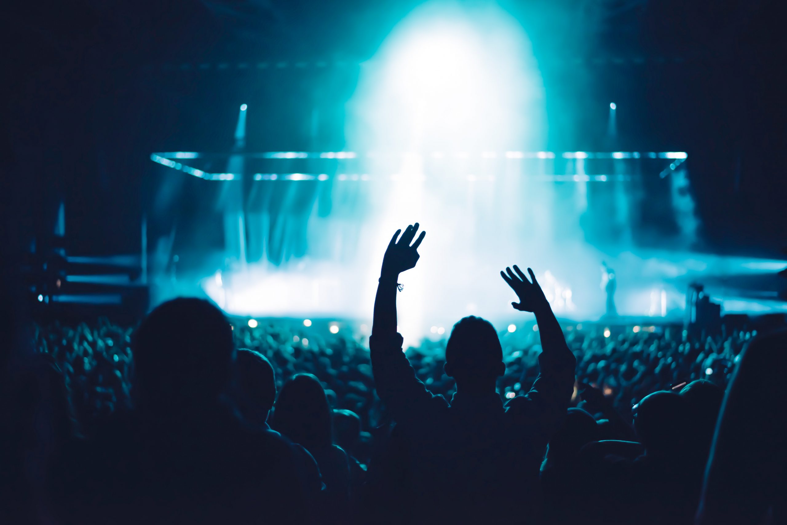 Large Event Crowd with Stage and Blue Lights