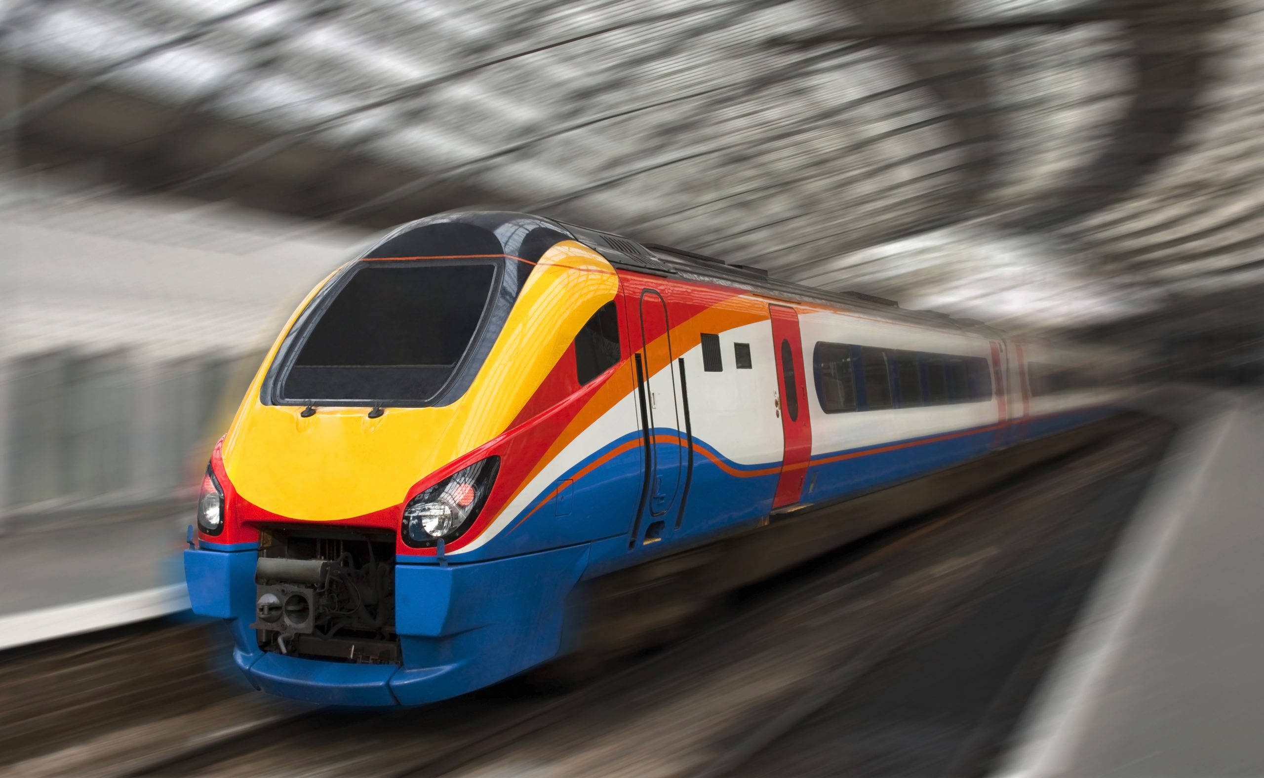 Modern Fast Passenger Train in the Station with Motion Blur