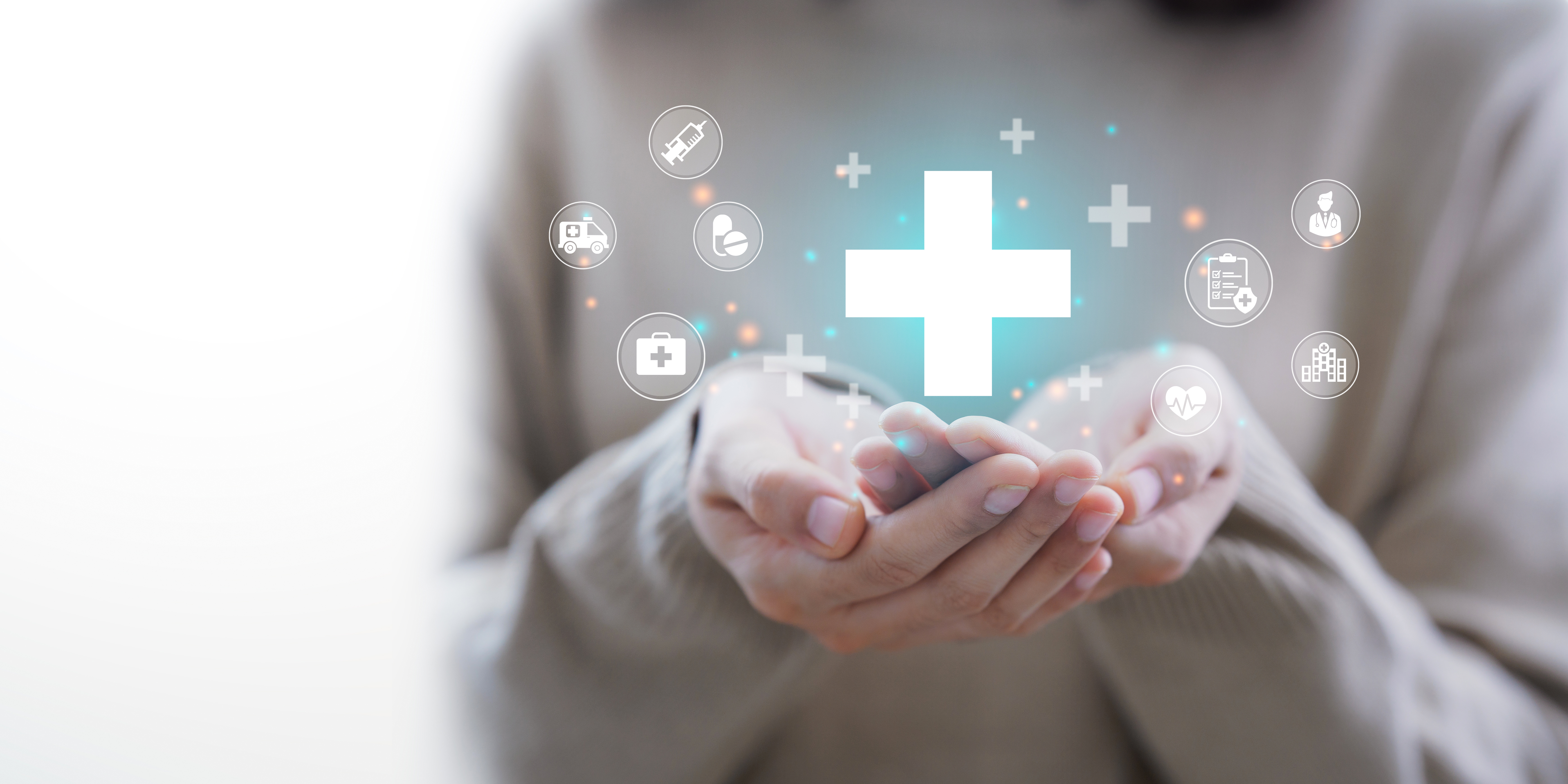 Hands appearing to hold graphics of medically related icons