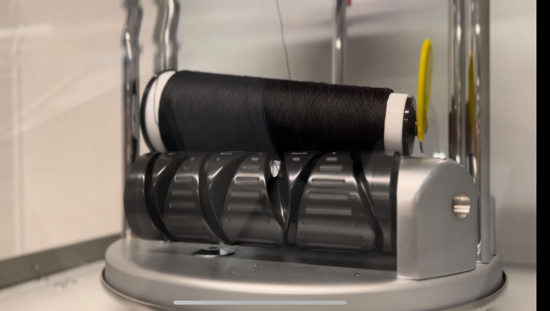 a spindle of black graphene yarn