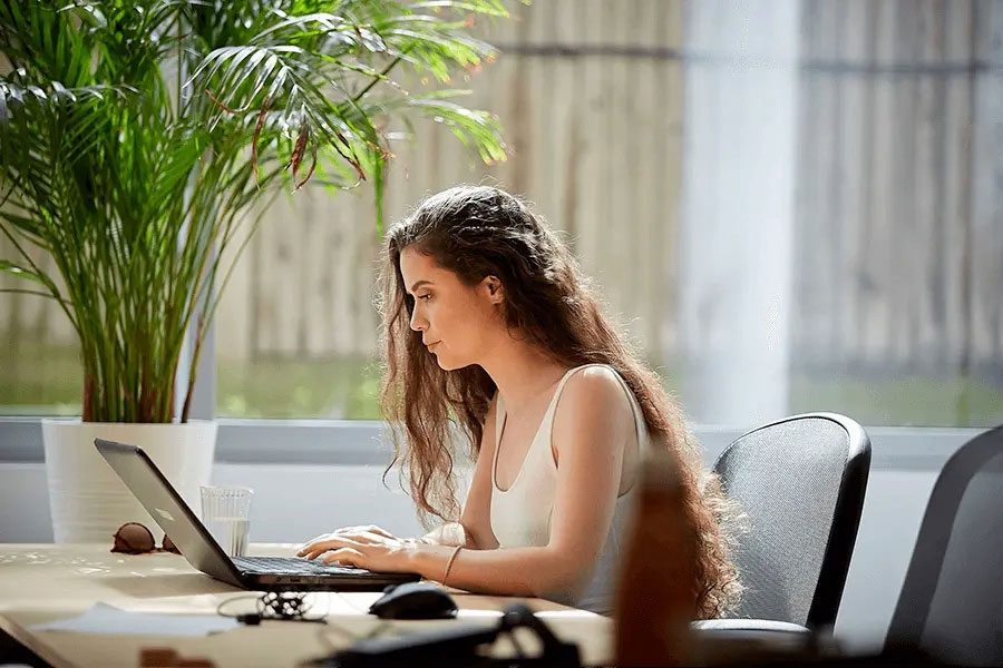woman working at a laptop computer