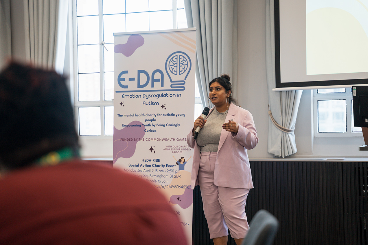 ZeZe presenting her work on peer support, training, and social action for autistic children.